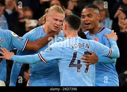 Manchester City's Erling Haaland (left) celebrates scoring their side's second goal of the game with team-mates Phil Foden and Manuel Akanji (right) during the Premier League match at the Etihad Stadium, Manchester. Picture date: Saturday November 5, 2022. Stock Photo