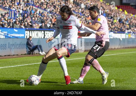 Bolton Wanderers defender Jordan Williams (4)challenged by Sheffield Wednesday midfielder Massimo Luongo (21) during the Sky Bet League 1 match between Bolton Wanderers and Sheffield Wednesday at the University of Bolton Stadium, Bolton on Saturday 9th April 2022. (Photo by Mike Morese/MI News/NurPhoto) Stock Photo