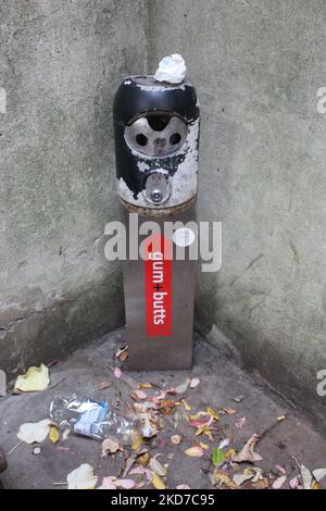 City of London Gum and Butts disposal point column in St Dunstan in the East Church Garden Stock Photo