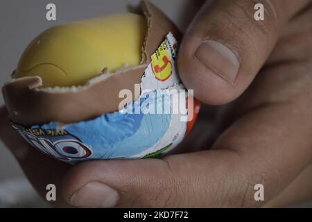 A young man uncovers a Kinder Surprise egg in Mexico City. The Federal Commission for the Protection against Health Risks (Cofepris) issued an alert on Monday about the possible salmonella contamination of four batches of Kinder mini eggs and Kinder Surprise Maxi, which are being voluntarily recalled worldwide by the manufacturer. (Photo by Gerardo Vieyra/NurPhoto) Stock Photo