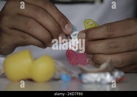 A young boy builds a toy after eating a Kinder Surprise egg in Mexico City. The Federal Commission for the Protection against Health Risks (Cofepris) issued an alert on Monday about the possible salmonella contamination of four batches of Kinder mini eggs and Kinder Surprise Maxi, which are being voluntarily recalled worldwide by the manufacturer. (Photo by Gerardo Vieyra/NurPhoto) Stock Photo