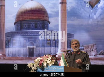 Commander of Iran’s Islamic Revolutionary Guard Corps’ (IRGC) Quds Force, Esmail Qaani gestures while standing next to an image of the Al-Aqsa mosque, during a ceremony in the Iranian Interior Ministry building in downtown Tehran, on April 14, 2022. (Photo by Morteza Nikoubazl/NurPhoto) Stock Photo