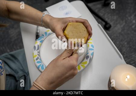 A Northeastern University student fills a “kistka" pen with beeswax before heating it over a candle. Members of Northeastern University’s Ukrainian Cultural Club held a Pysanka-making workshop on campus, ahead of Ukrainian Easter. Designs are drawn with wax and the eggs are dyed in layers, beginning with the lightest color and working up to red or black. At the end, the wax is removed to reveal an elaborately decorated egg. (Photo by Jodi Hilton/NurPhoto) Stock Photo