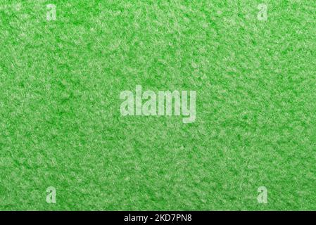 Luxurious green fabric with fibers and pile. Textile. Velveteen material Stock Photo