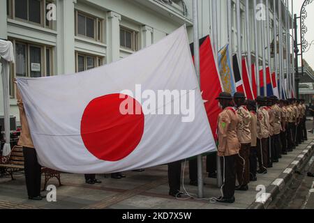 Scout members raise the flag of the Asian-African conference members on April 18, 2022, at Gedung Merdekap, Bandung, West Java, Indonesia. The Museum of the Asian-African Conference raised the flags of 109 sovereign nations participating in the 1955 conference and the united nation flag with the theme 'Recover Together, Recover Stronger' at the 67th Anniversary of the Asian-African Conference. (Photo by Algi Febri Sugita/NurPhoto) Stock Photo