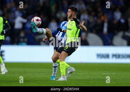 Porto’s Brazilian forward Evanilson (L) vies with Sporting's Portuguese defender Goncalo Inacio (R) during the Portuguese Cup Semifinal match between FC Porto and Sporting CP at Dragao Stadium on April 21, 2022 in Porto, Portugal. (Photo by Paulo Oliveira / NurPhoto) Stock Photo