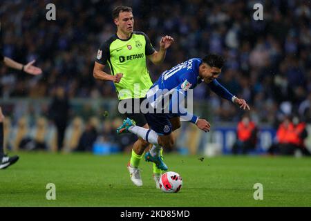 Porto’s Brazilian forward Evanilson (R) vies with Sporting's Uruguayan midfielder Manuel Ugarte (L) during the Portuguese Cup Semifinal match between FC Porto and Sporting CP at Dragao Stadium on April 21, 2022 in Porto, Portugal. (Photo by Paulo Oliveira / NurPhoto) Stock Photo