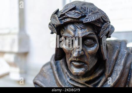 Florence, Italy; October 28, 2022: Bronze sculpture of Dante Alighieri in the courtyard of Badia Fiorentina. Stock Photo