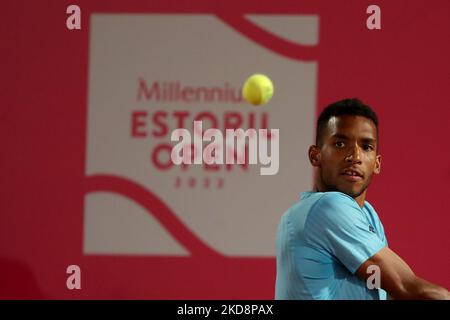 Felix Auger-Aliassime of Canada returns a shot to opponent Borna Coric ...