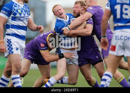 Lachlan Walmsley of Halifax Panthers is tackled by Brad Day and Callum Field of Newcastle Thunder during the BETFRED Championship match between Newcastle Thunder and Halifax Panthers at Kingston Park, Newcastle on Saturday 30th April 2022. ( (Photo by Chris Lishman/MI News/NurPhoto) Stock Photo