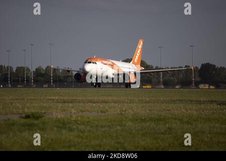 EasyJet Europe Airbus A319 aircraft as seen during taxiing, rotate and take off phase flying as departs from Amsterdam Schiphol Airport. The A319 has the registration OE-LQN. EasyJet is a British multinational low cost airline group with headquarters at London Luton Airport while EasyJet Europe Airline GmbH is based in Vienna Austria with a fleet of 127 airplane. The aviation industry is showing recovery and increased demand after the Covid-19 Coronavirus pandemic measures have been easing across the worlds. Amsterdam, Netherlands on April 27, 2022 (Photo by Nicolas Economou/NurPhoto) Stock Photo