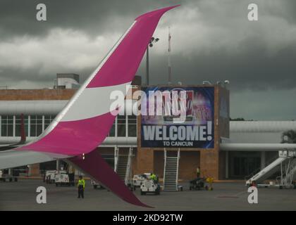 Logo of Swoop, a Canadian ultra low-cost carrier owned by WestJet, seen on the wing of the Swoop plane at Cancun International Airport. On Monday, 30 April 2022, in Cancun International Airport, Cancun, Quintana Roo, Mexico. (Photo by Artur Widak/NurPhoto) Stock Photo