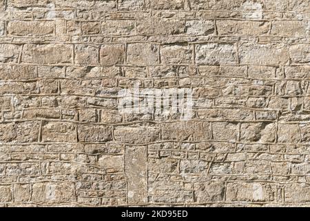 Stone wall, seamless repeating pattern or texture. Detail of an ancient church in UK Stock Photo
