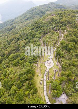 The wisdom path in form of infinity which engraves on wooden pillars the verses of the ''Heart Sutra'', a Buddhist religious text, and which is found in the Ngong Ping monastery in Lantau island. View by drone, in Hong Kong, China, on 10 May 2022. (Photo by Marc Fernandes/NurPhoto) Stock Photo