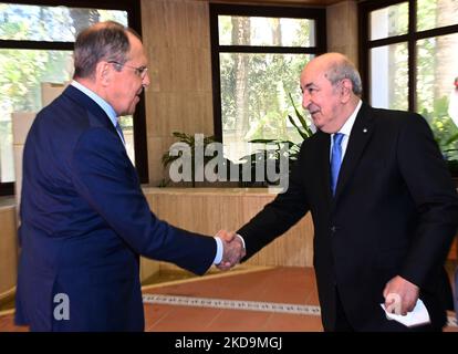 A photo of the publication published by the press service of the Algerian presidency shows that Algerian President Abdelmadjid Tebboune (right) meets Russian Foreign Minister Sergey Lavrov (left) at El Mouradia Palace in Algiers, Algeria on May 10, 2022. Russian Foreign Minister Sergei Lavrov is on an official visit to Algeria (Photo by APP/NurPhoto) Stock Photo