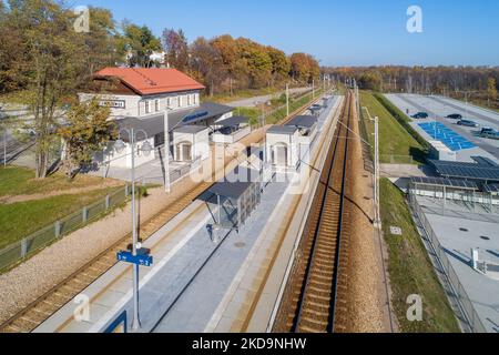 Newly modernized small railway station in Swoszowice district in Krakow, Poland, for fast city trains and regional passengers transportation. Big park Stock Photo