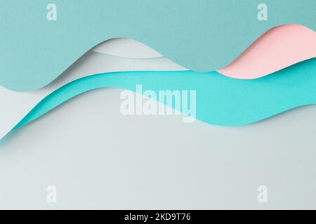 Abstract colored paper texture background. Paper cut composition with layers of geometric shapes and lines in turquoise, aquamarine, pastel green and Stock Photo