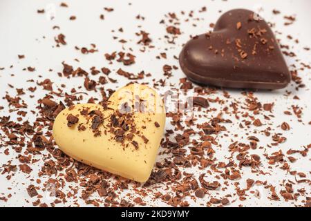 View of two chocolate hearts on a white background, close-up. Valentine's Day concept Stock Photo