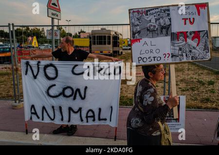 Volunteers show signs during the protest against the exploitation of animals in the Orfei circus of Molfetta on May 14, 2022. Sit-in protest against the exploitation of animals in entertainment shows, near the settlement area of ??the Orfei circus, currently present in the city of Molfetta. The garrison involved a group of citizens of Molfetta, led by the volunteers of the animal rights association 'Lo Stregatto - Molfetta'(Photo by Davide Pischettola/NurPhoto) Stock Photo