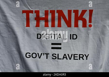 A t-shirt for sale with words 'Think! Digital ID + Gov't Slavery'. People gather in protest against COVID-19 mandates during the 'Alberta Wide Freedom Convoy - No More Mandates' protest outside the Alberta Legislature in Edmonton. On Saturday, May 14, 2022, in Edmonton, Alberta, Canada. (Photo by Artur Widak/NurPhoto) Stock Photo