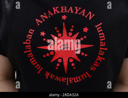 Logo of Anakbayan Alberta, a National Democratic organization that organizes filipino youth in the diaspora in the province of Alberta. Members of the local Filipino youth diaspora (Anakbayan Alberta) protest outside the Alberta Legislature in Edmonton, calling out the Commission on Elections (COMELEC) in Philippines for their negligence and failure to uphold honest and fair elections last May 9, 2022. The organisers of the protest said: 'We condemn another political dynasty with the Marcos-Duterte tandem that continues the fascist regime among the Filipinos'. On Sunday, May 15, 2022, in Edmon Stock Photo