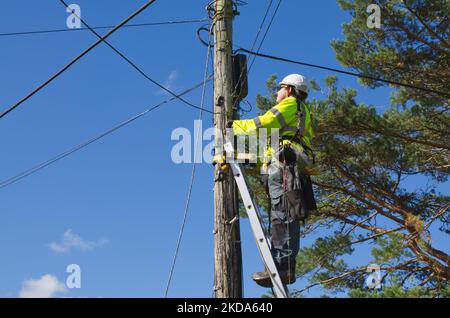 UK internet and telephone provider at work providing internet and telephone services to rural locations Stock Photo