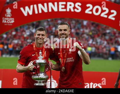 Liverpool's James Milner holds the FA Cup with Liverpool's Jordan Henderson after their sides 6-5 penalty shoot-out after a 0-0 draw in normal time FA Cup Final between Chelsea and Liverpool at Wembley Stadium , London, UK 14th May , 2022 (Photo by Action Foto Sport/NurPhoto) Stock Photo