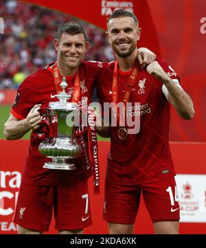 Liverpool's James Milner holds the FA Cup with Liverpool's Jordan Henderson after their sides 6-5 penalty shoot-out after a 0-0 draw in normal time FA Cup Final between Chelsea and Liverpool at Wembley Stadium , London, UK 14th May , 2022 (Photo by Action Foto Sport/NurPhoto) Stock Photo