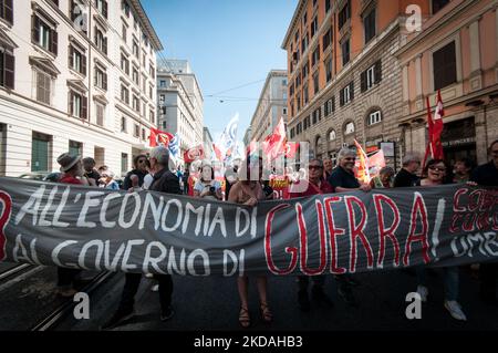 People take part in a demonstration against sending weapons to Ukraine and against the increasing military budgets, in Rome, Italy, on May 20, 2022. A general strike against the war called by the Unione Sindacale di Base and Cobas in Rome. 'Raise wages and lower arms' the banner that opened the procession that crossed the centre of the Capital. (Photo by Andrea Ronchini/NurPhoto) Stock Photo