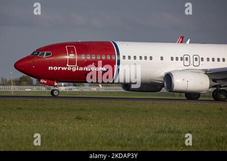 Norwegian Boeing 737-800 aircraft departing from Amsterdam Schiphol Airport. The airplane belongs to Norwegian Air Sweden AOC, a Swedish airline, subsidiary of Norwegian Air Shuttle low cost carrier. The B738 passenger jet airplane has the registration SE-RPH and the name Fredrika Bremer with her portrait part of the livery on the tail fin. As the Covid-19 Coronavirus pandemic measures are suspended the aviation, travel and tourism industry are having increased demand for flights. Amsterdam, The Netherlands on April 27, 2022 (Photo by Nicolas Economou/NurPhoto) Stock Photo