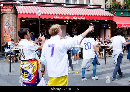 Real Madrid supporters celebrate in the streets of the Latin Quarter in Paris for the Champions League final, in Paris, France, on May 28, 2022.(Photo by Vincent Koebel/NurPhoto) Stock Photo