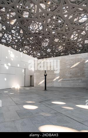 The Walking Man, on a column, by Auguste Rodin at The Louvre, Abu Dhabi. Situated in Saadiyat Island cultural district. Stock Photo