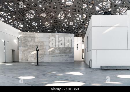 The Walking Man, on a column, by Auguste Rodin at The Louvre, Abu Dhabi. Situated in Saadiyat Island cultural district Stock Photo