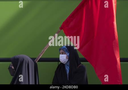 Two Iranian Basiji (Members of Basij Paramilitary force) female university students attend a rally to mark the thirty-third death anniversary of Founder of the Islamic Republic, Ayatollah Ruhollah Khomeini, in front of the main gate of the University of Tehran on June 3, 2022. (Photo by Morteza Nikoubazl/NurPhoto) Stock Photo