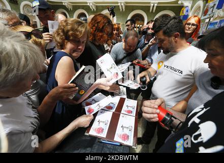 People queue to cancellation of a new set of commemorative postal service stamps dedicated to the Ukrainian resistance, amid Russia's invasion of Ukraine, at main postal office in Odesa, Ukraine 10 June 2022. The new set of postal stamps ''Assol is no the same anymore'' is a like unofficial sequel of set of Ukraine's postage stamps 'Russian warship - Done!'. The postage stamps are issued by a private initiative in a limited edition in 400 pieces and has traditionally caused a stir among Ukrainians, as local media informed. The collected funds from the sale of the new postage marks will be used Stock Photo