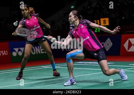 Thinaah Muralitharan and Pearly Tan of Malaysia compete in the Women's Doubles semi finals match against Siti Fadia Silva Ramadhanti and Apriyani Rahayu of Indonesia on day five of the Daihatsu Indonesia Masters at Istora Senayan on June 11, 2022 in Jakarta, Indonesia. (Photo by Garry Lotulung/NurPhoto) Stock Photo