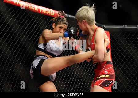 Silvana Gomez Juarez of Argentina (L) battles Liang Na of China in the women’s strawweight bout during the UFC 275 event at Singapore Indoor Stadium on June 12, 2022 in Singapore. (Photo by Suhaimi Abdullah/NurPhoto) Stock Photo