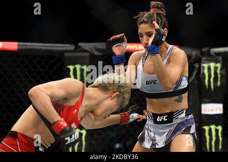 Silvana Gomez Juarez of Argentina (R) battles Liang Na of China in the women’s strawweight bout during the UFC 275 event at Singapore Indoor Stadium on June 12, 2022 in Singapore. (Photo by Suhaimi Abdullah/NurPhoto) Stock Photo