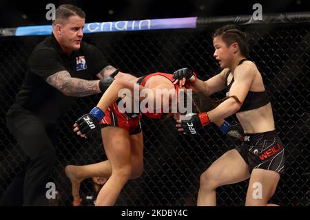 Zhang Weili of China (R) battles Joanna Jedrzejczyk of Poland in the women’s strawweight bout during the UFC 275 event at Singapore Indoor Stadium on June 12, 2022 in Singapore. (Photo by Suhaimi Abdullah/NurPhoto) Stock Photo