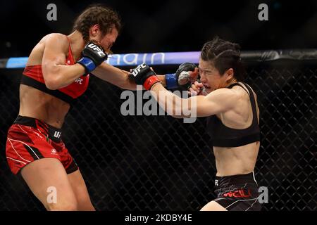 Zhang Weili of China (R) battles Joanna Jedrzejczyk of Poland in the women’s strawweight bout during the UFC 275 event at Singapore Indoor Stadium on June 12, 2022 in Singapore. (Photo by Suhaimi Abdullah/NurPhoto) Stock Photo