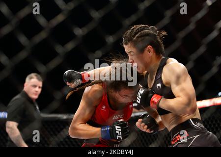 Zhang Weili of China (R) battles Joanna Jedrzejczyk of Poland in the women’s strawweight bout during the UFC 275 event at Singapore Indoor Stadium on June 12, 2022 in Singapore. (Photo by Suhaimi Abdullah/NurPhoto) Stock Photo