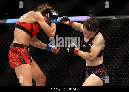 Zhang Weili of China (R) battles Joanna Jedrzejczyk of Poland in the women’s strawweight bout during the UFC 275 event at Singapore Indoor Stadium on June 12, 2022 in Singapore. (Photo by Suhaimi Abdullah/NurPhoto) Stock Photo