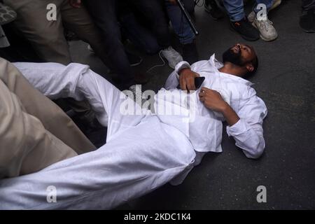 A protestor faints as he gets detained during a demonstration alleging targeted demolition drive against Muslims following clashes last week triggered by remarks by a former Bharatiya Janata Party (BJP) spokesperson Nupur Sharma on Prophet Mohammed, in New Delhi, India on June 13, 2022. (Photo by Mayank Makhija/NurPhoto) Stock Photo