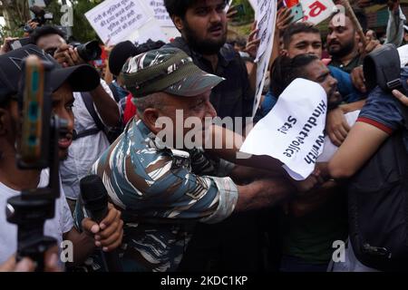 A security personnel tries to detin protestors during a demonstration alleging targeted demolition drive against Muslims following clashes last week triggered by remarks by a former Bharatiya Janata Party (BJP) spokesperson Nupur Sharma on Prophet Mohammed, in New Delhi, India on June 13, 2022. (Photo by Mayank Makhija/NurPhoto) Stock Photo