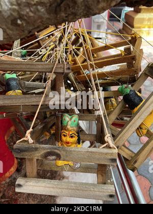 Small wooden cradles placed by Hindu families praying to have children hanging on the branches of a tree at the Pazhanchira Devi Temple in Thiruvananthapuram (Trivandrum), Kerala, India on May 26, 2022. Sree Pazhanchira Devi Temple is one of the most ancient temples. The temple is almost 700 years old and is an excellent example of Kerala Vasthu Vidya and temple architecture. This heritage structure is placed under the list of monuments of national importance. (Photo by Creative Touch Imaging Ltd./NurPhoto) Stock Photo