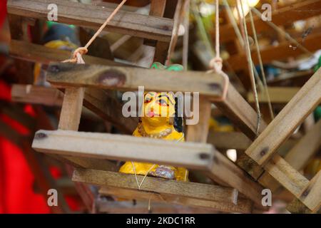 Small wooden cradles placed by Hindu families praying to have children hanging on the branches of a tree at the Pazhanchira Devi Temple in Thiruvananthapuram (Trivandrum), Kerala, India on May 26, 2022. Sree Pazhanchira Devi Temple is one of the most ancient temples. The temple is almost 700 years old and is an excellent example of Kerala Vasthu Vidya and temple architecture. This heritage structure is placed under the list of monuments of national importance. (Photo by Creative Touch Imaging Ltd./NurPhoto) Stock Photo