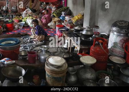 People take shelter in a building as they left their house after flash floods at Compamiganj area in Sylhet, Bangladesh on June 20, 2022. At least 26 more people have died in monsoon flooding and lightning strikes in India, as millions remained marooned in the country and neighbouring Bangladesh, authorities said on June 20. (Photo by Syed Mahamudur Rahman/NurPhoto) Stock Photo