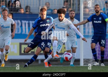 Claudinho (11) of Zenit St. Petersburg and Dmitri Rybchinsky (94) of Pari Nizhny Novgorod vie for the ball during the PARI Premier Cup preseason tournament match between Zenit St. Petersburg and Pari Nizhny Novgorod on June 21, 2022 at Smena Stadium in Saint Petersburg, Russia. (Photo by Mike Kireev/NurPhoto) Stock Photo