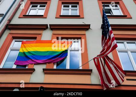 LGBT pride flag is hanging next to the US national flag over the ...