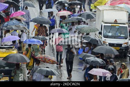 People carry umbrella during heavy rainfall in Mumbai, India, 27 June, 2022. (Photo by Indranil Aditya/NurPhoto) Stock Photo